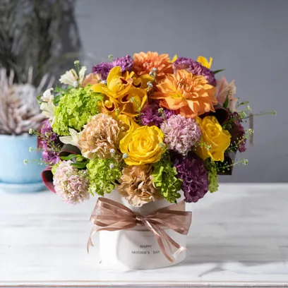 陽だまり色で季節のお花アレンジメント